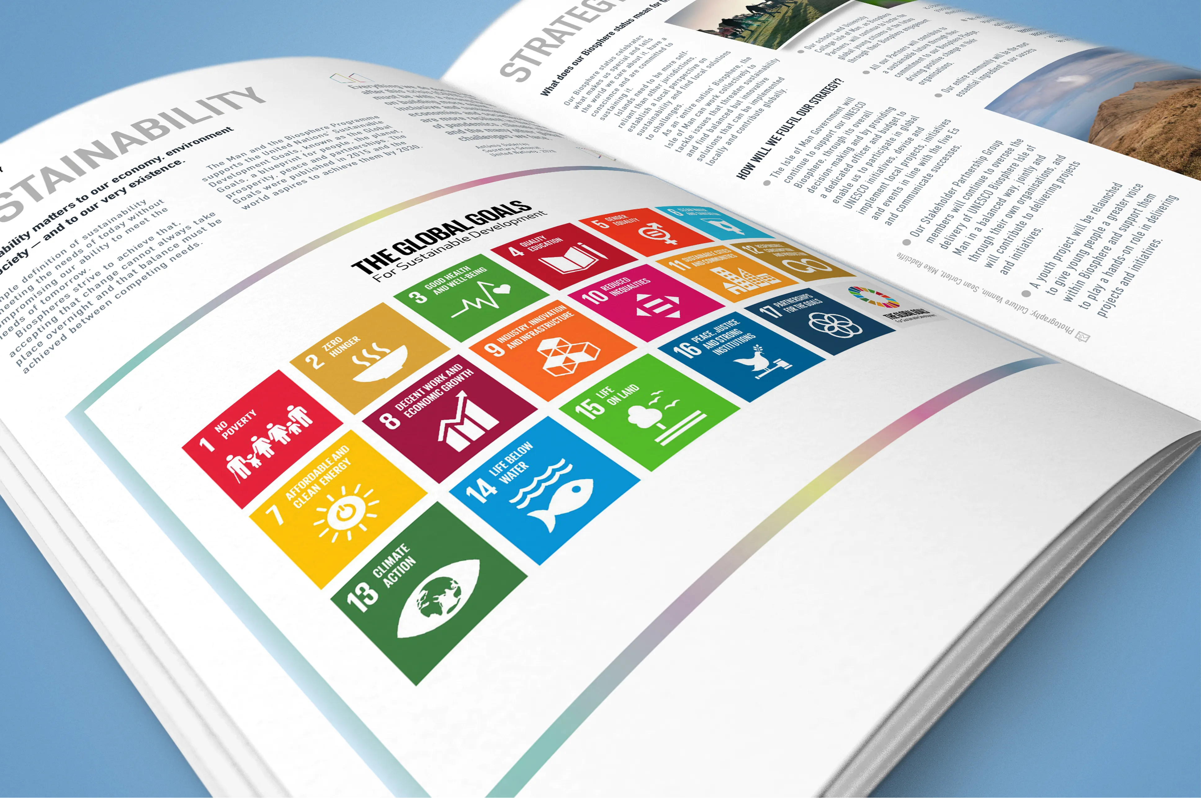Biosphere Isle of Man printed publication open at a sustainability spread featuring the UN Global Goals icon grid, designed by DotPerformance